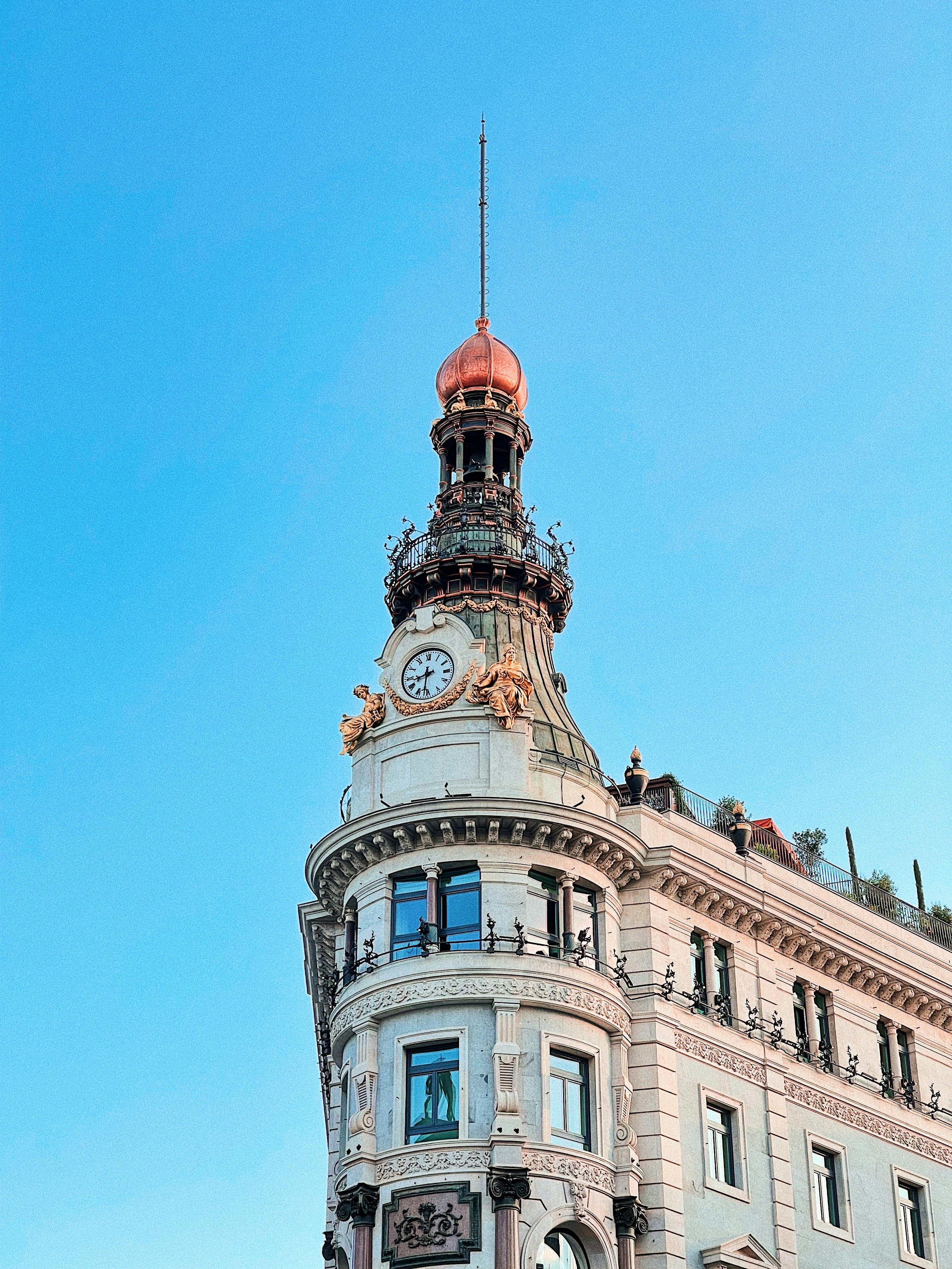 white and brown concrete building under blue sky during daytime